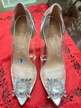 BCBGeneration Clear PVC Pointed Toe Pumps with Silver Crystal Brooch